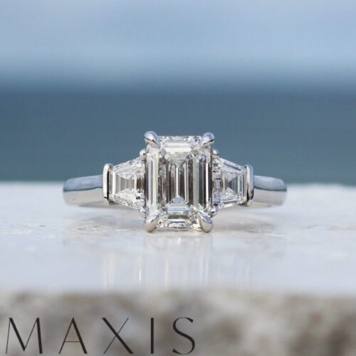 White Gold Emerald Cut Diamond and Trapezoid Trilogy Engagement Ring